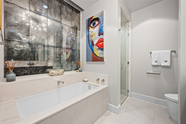 bathroom featuring separate shower and tub, toilet, and tile floors