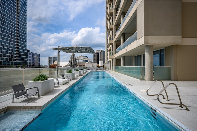 view of swimming pool with a patio area