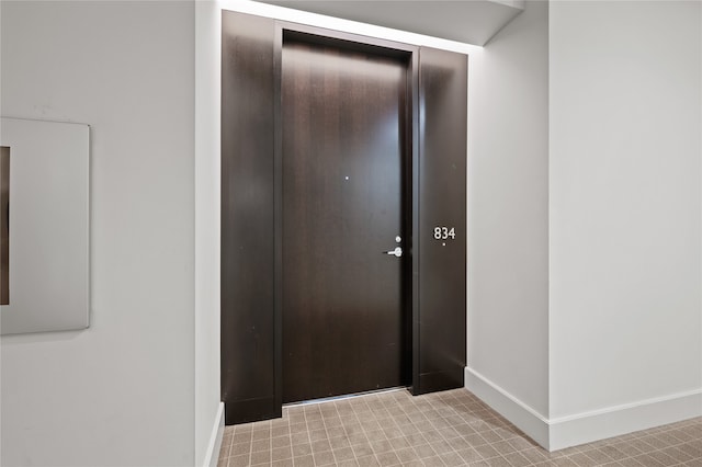 hallway with light tile floors