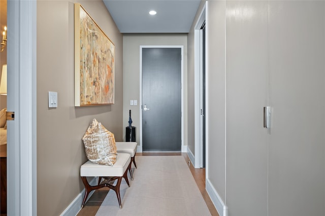 corridor with wood-type flooring