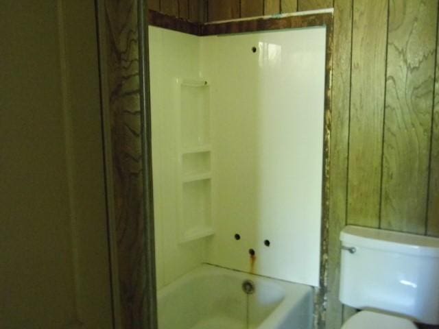 bathroom with toilet and shower / tub combination