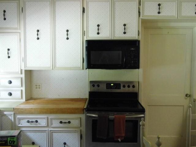 kitchen with stainless steel electric range oven