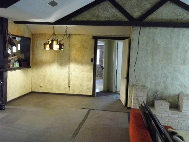 interior space with vaulted ceiling with beams