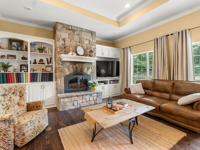 living room with a fireplace, dark hardwood / wood-style floors, and ornamental molding