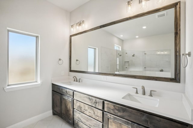 bathroom featuring vanity and a tile shower