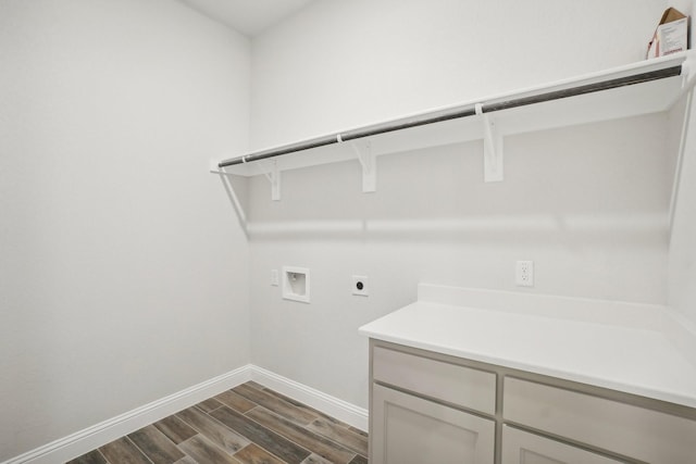 laundry room featuring cabinets, hookup for a washing machine, and hookup for an electric dryer