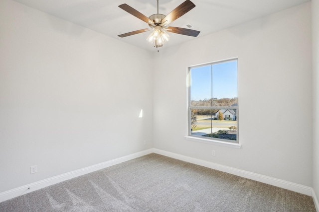 empty room featuring carpet and ceiling fan