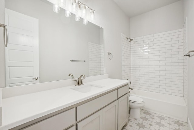 full bathroom with toilet, vanity, and tiled shower / bath