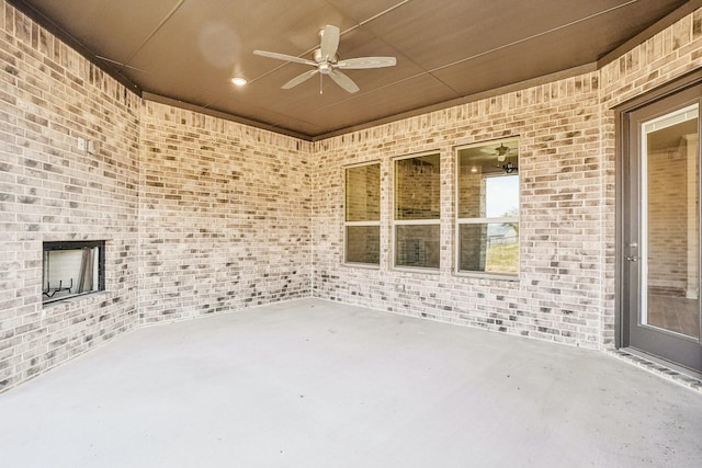 view of patio featuring ceiling fan