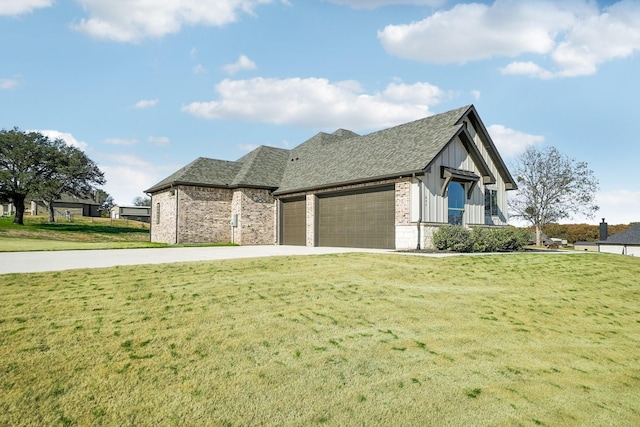 view of front of property with a front yard and a garage