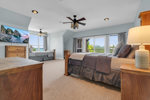 bedroom with light carpet, ceiling fan, and multiple windows