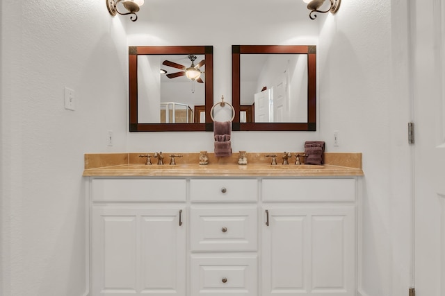 bathroom featuring dual bowl vanity and ceiling fan