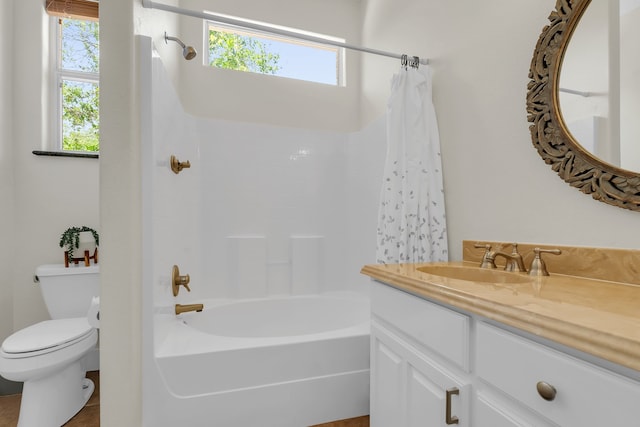 full bathroom featuring shower / bathtub combination with curtain, large vanity, plenty of natural light, and toilet