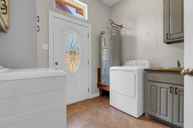 laundry room featuring cabinets, washing machine and clothes dryer, sink, light tile floors, and electric water heater