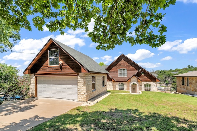 view of front of house with a garage and a front lawn