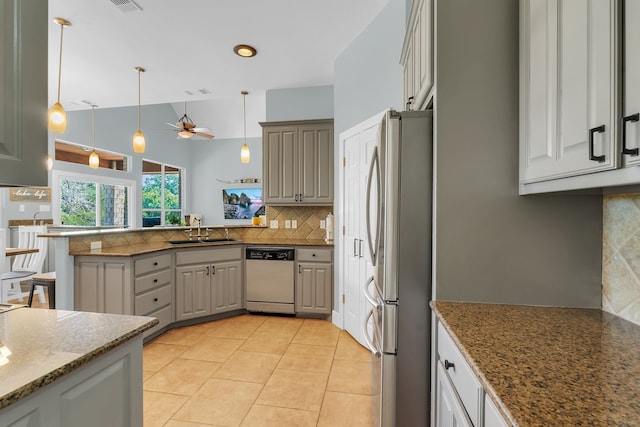 kitchen featuring dishwasher, gray cabinetry, ceiling fan, stainless steel fridge, and pendant lighting