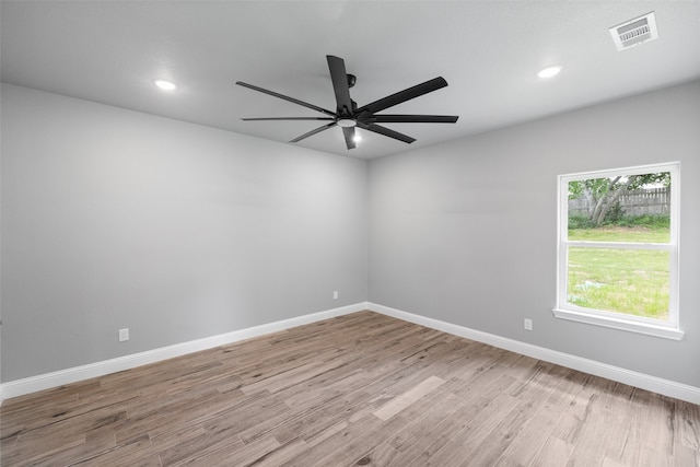 unfurnished room with ceiling fan and light wood-type flooring