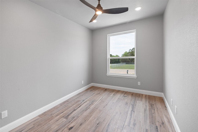 unfurnished room with ceiling fan and light hardwood / wood-style flooring