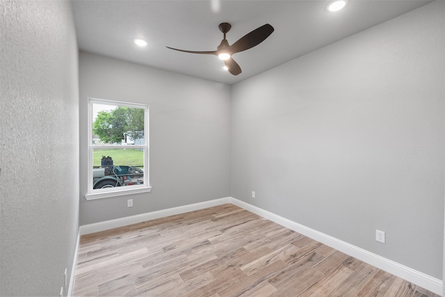 unfurnished room featuring ceiling fan and light wood-type flooring