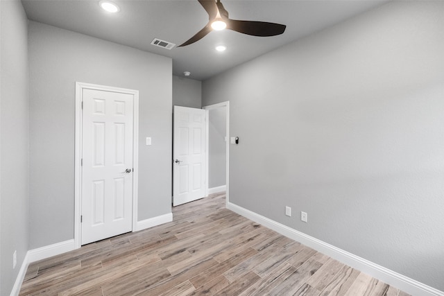 unfurnished bedroom featuring ceiling fan and light hardwood / wood-style flooring