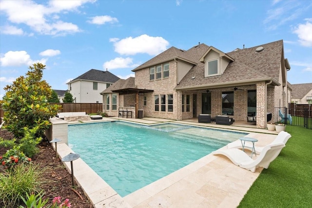 view of pool featuring ceiling fan, outdoor lounge area, and a patio area