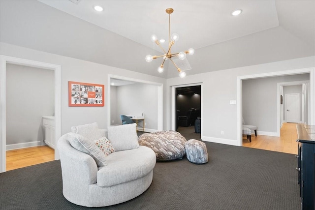 living room featuring lofted ceiling, carpet flooring, and a chandelier