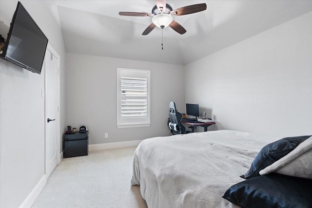 carpeted bedroom featuring lofted ceiling and ceiling fan