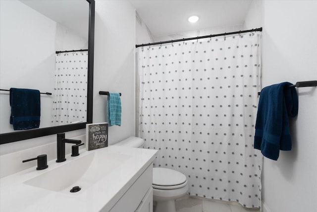 bathroom featuring vanity, a shower with curtain, tile patterned floors, and toilet