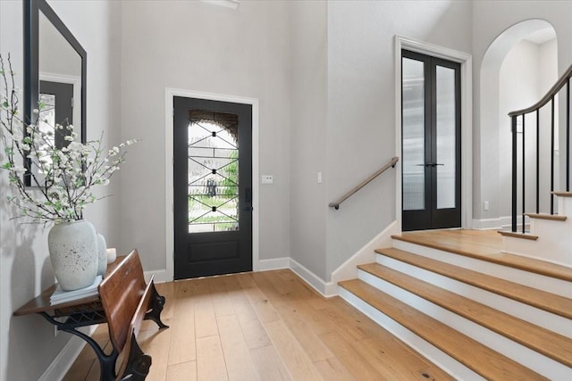 entryway featuring french doors and light hardwood / wood-style floors