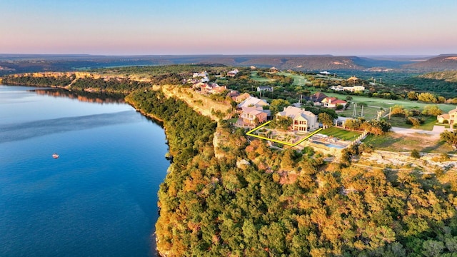 aerial view at dusk with a water view