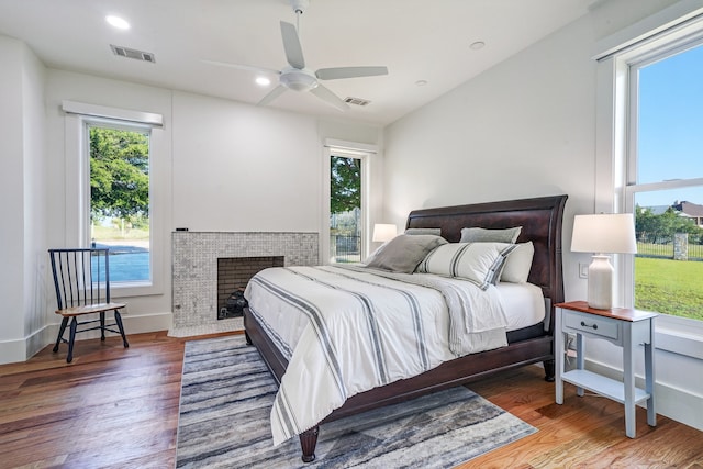 bedroom with hardwood / wood-style flooring and ceiling fan