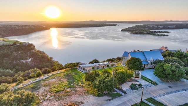 aerial view at dusk with a water view