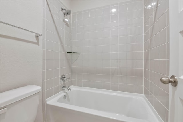 bathroom with toilet and tub / shower combination