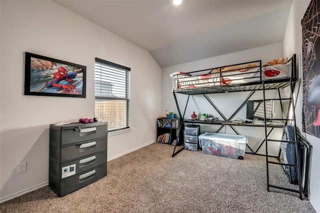 bedroom featuring carpet floors and lofted ceiling