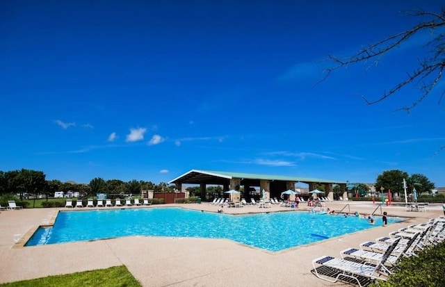 view of swimming pool featuring a patio area