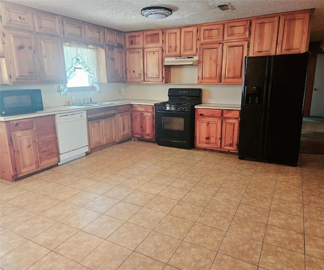 kitchen featuring sink, a textured ceiling, black appliances, and light tile patterned floors