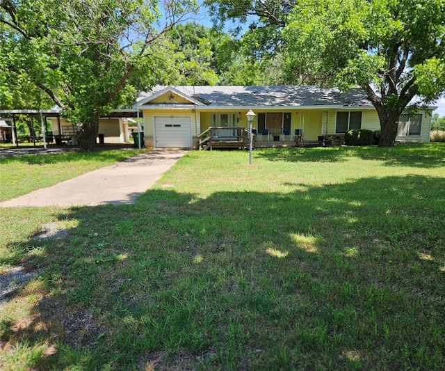 ranch-style home with a garage and a front yard