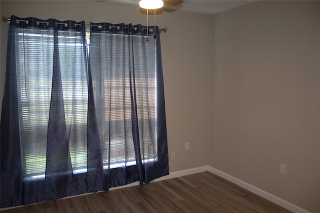 unfurnished room with ceiling fan and hardwood / wood-style flooring