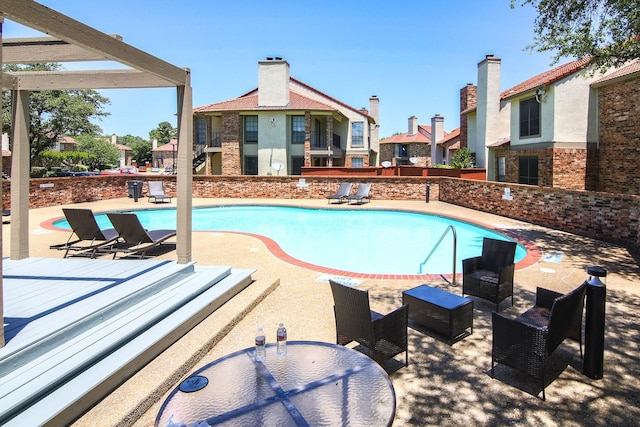 view of pool featuring a patio