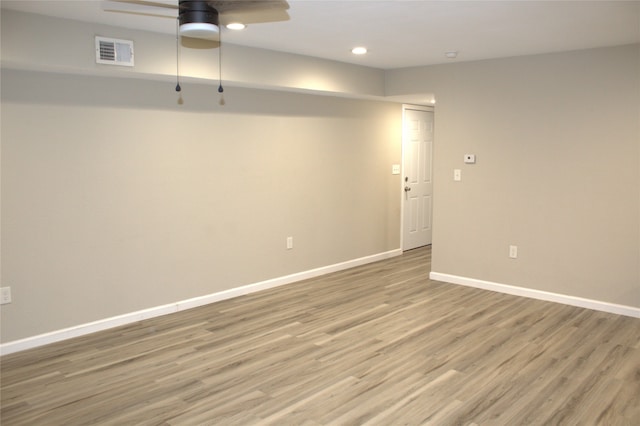 unfurnished room with hardwood / wood-style flooring and ceiling fan