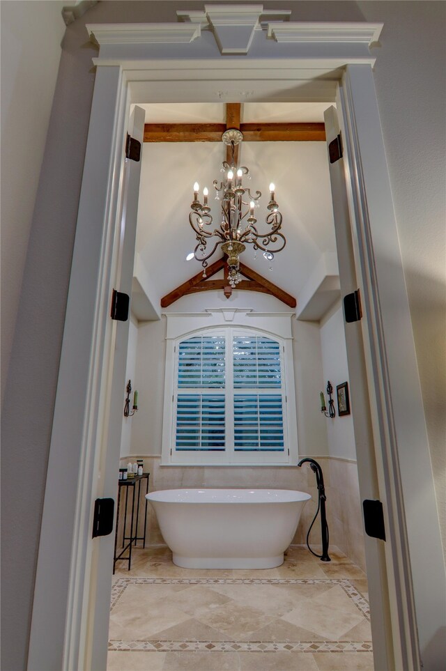 bathroom featuring tile flooring, vaulted ceiling with beams, and an inviting chandelier