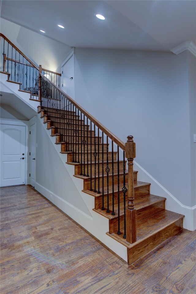 staircase featuring hardwood / wood-style floors