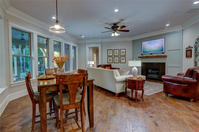 dining room featuring ceiling fan, hardwood / wood-style floors, and ornamental molding