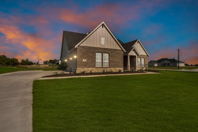 view of front of home with a lawn