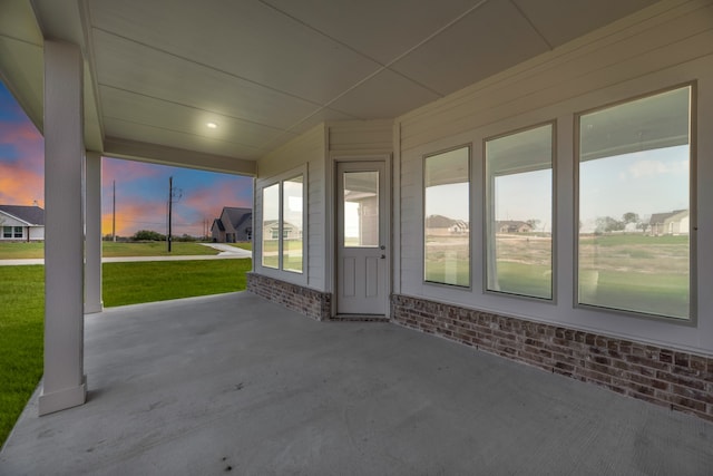 unfurnished sunroom featuring plenty of natural light