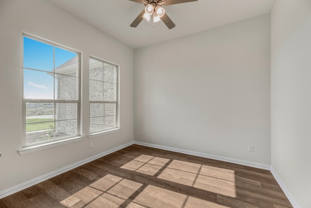 empty room with hardwood / wood-style flooring and ceiling fan