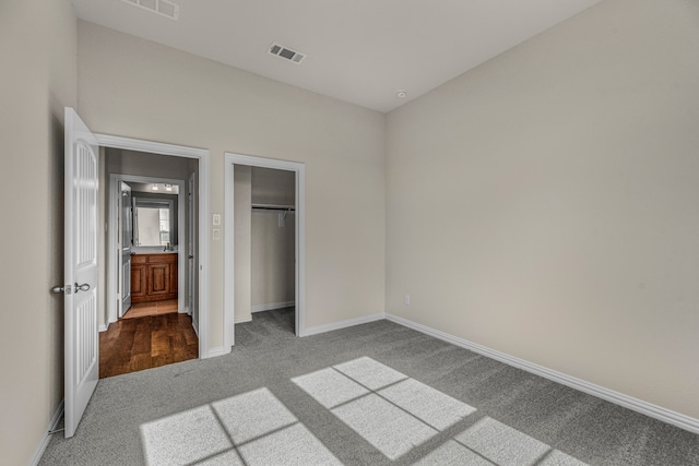 unfurnished bedroom with carpet floors and a closet