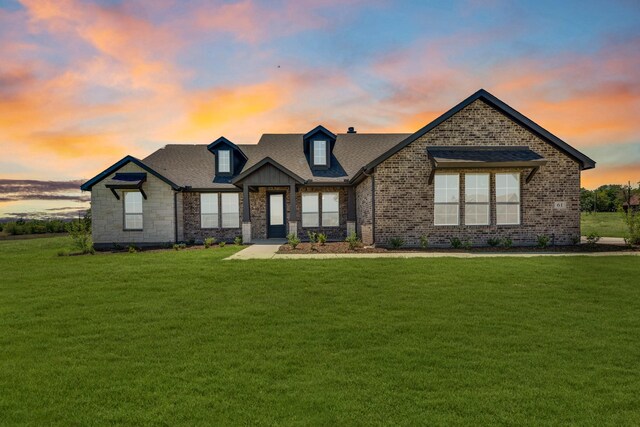 view of front of house with a lawn