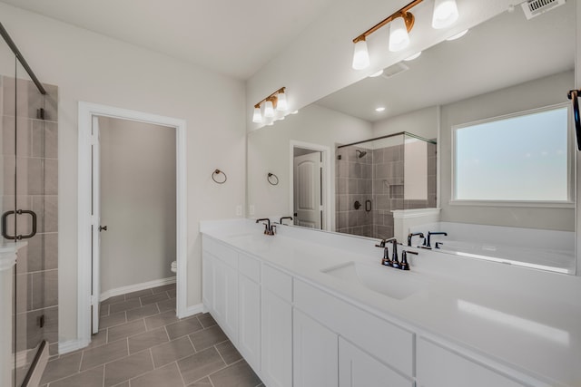 bathroom with double sink vanity, walk in shower, toilet, and tile patterned floors