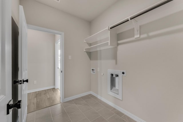 laundry room featuring hookup for a washing machine, gas dryer hookup, electric dryer hookup, laundry area, and baseboards